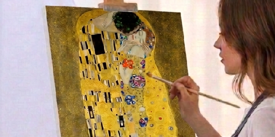 Woman painting Gustav Klimt’s The Kiss on an easel in a warm, artistic workspace.